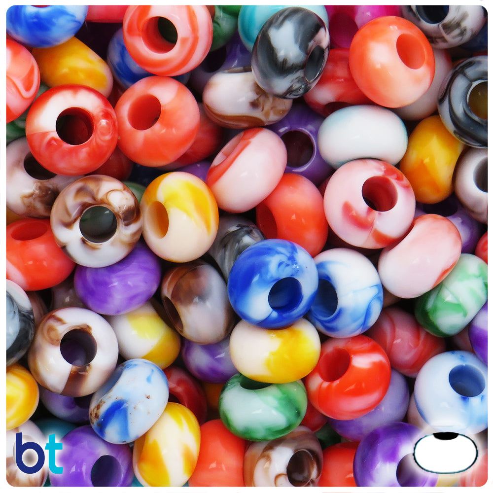 A close-up pile of round marbled craft beads in many colors, including red, orange, blue, purple, white, yellow, green, and black swirls. A small 'bt' logo appears in the bottom-left corner.